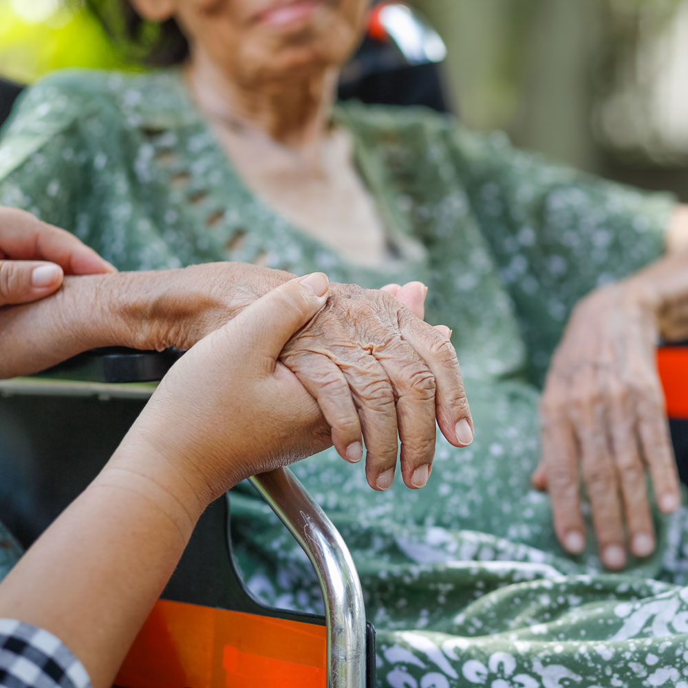 elderly woman with care giver