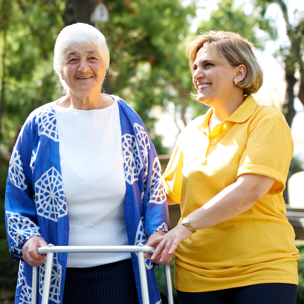 elderly woman with caregiver